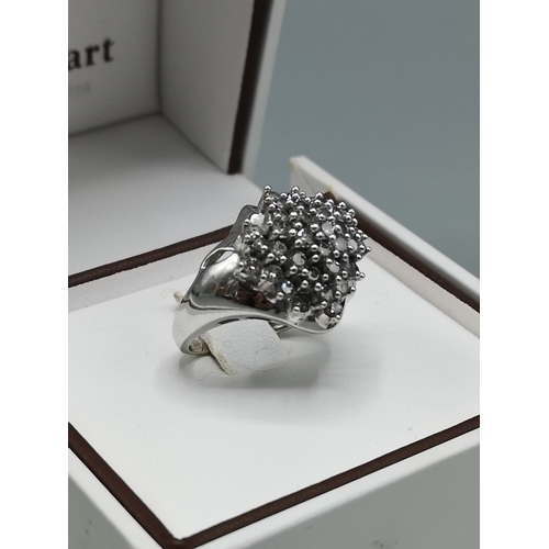 376 - Large 14kt white gold diamond cluster  ring .
