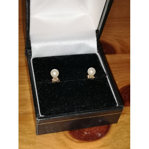 25 - Pair of 9ct gold earrings.