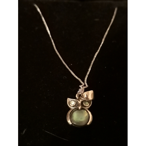 74 - Silver chain and owl pendant.