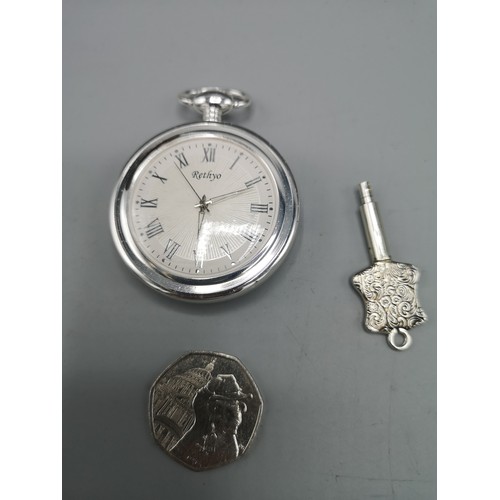 34 - Pocket watch with key.