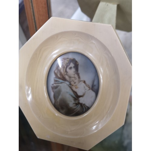 29a - Victorian painting in bone frame of mother and child.