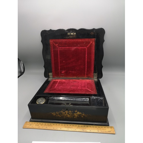 39 - Victorian black japanned writing slope with fitted interior and inkwell.