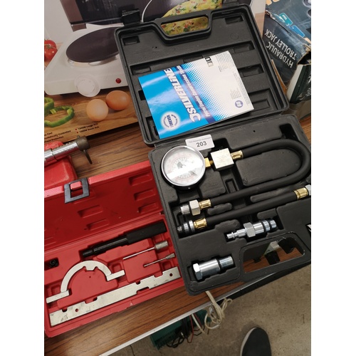 203 - Petrol engine compressing testing tool boxed together with other instrument tool boxed.