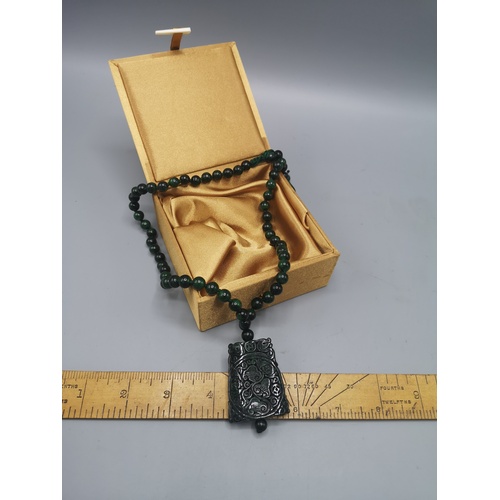 1a - Dark carved jade sheld small pendant with beaded  necklace with silk display box . 84 grams 60 - 80 ... 