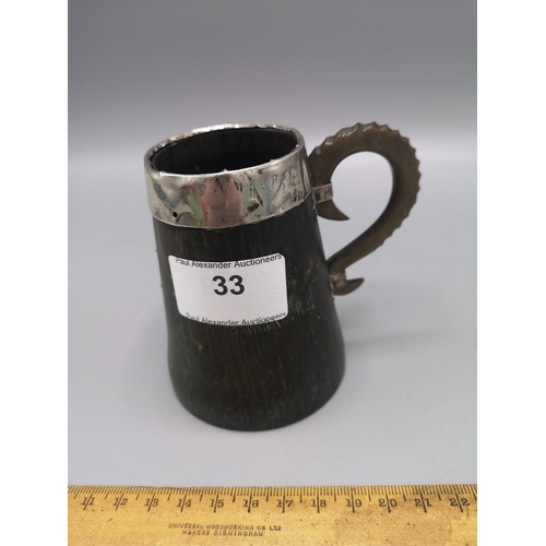 33 - Scottish horn arts and crafts tankard with silver rimmed topped.