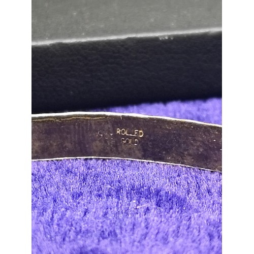 29 - 9ct rolled gold bangle with heart design. 8.81 grams gross weight .