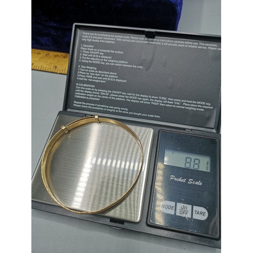 29 - 9ct rolled gold bangle with heart design. 8.81 grams gross weight .