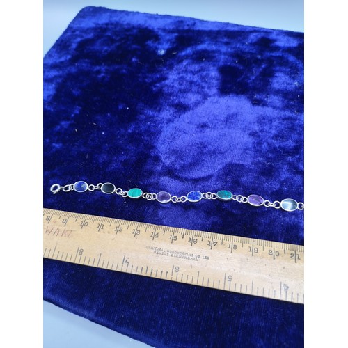 39b - Silver bracelet with stones.