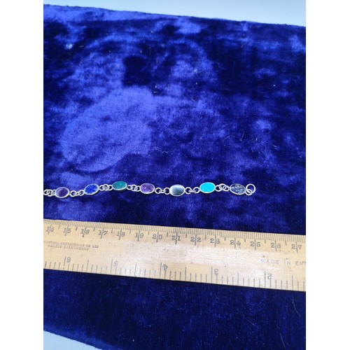 39b - Silver bracelet with stones.