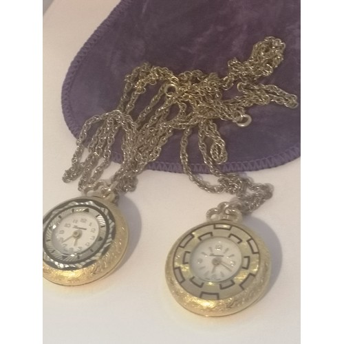 51 - 2 pocket watches with chains . Both ticking .