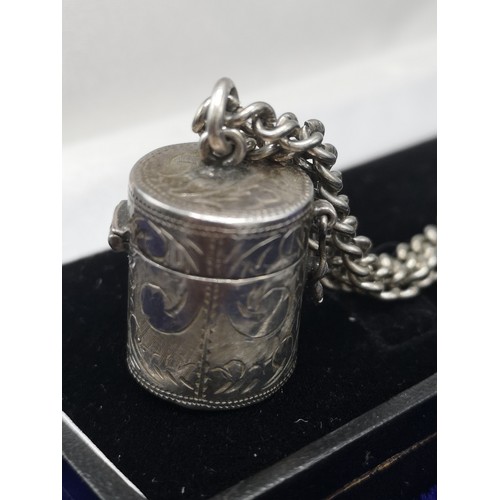 8a - Silver secret snuff box on white metal chain .
