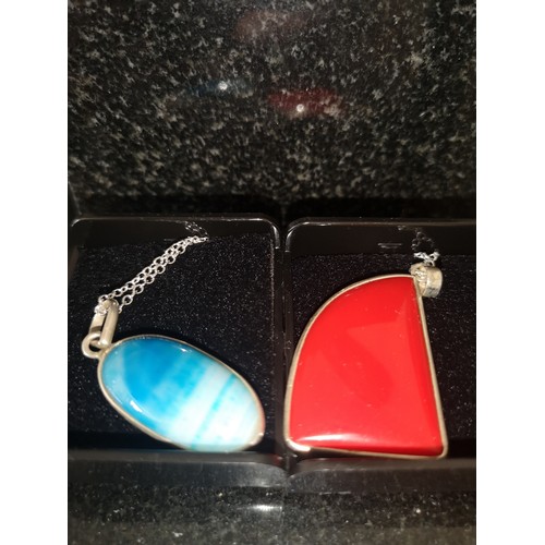 45f - 2 silver chains and pendants.