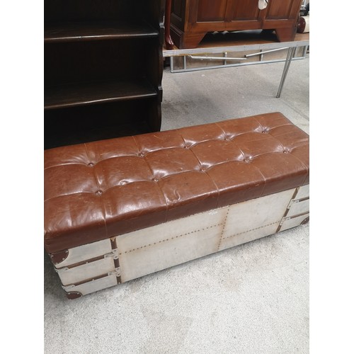 102 - Leather topped ottoman with metal base.