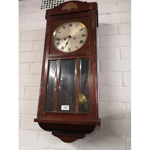 225 - Oak wall clock with pendulum.