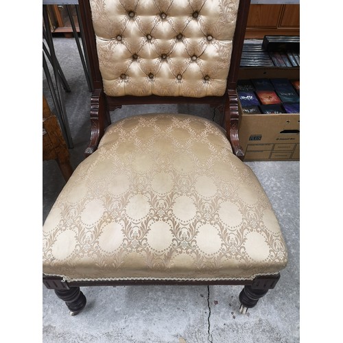 67 - Stunning button back antique nursing chair with silk upholstery.