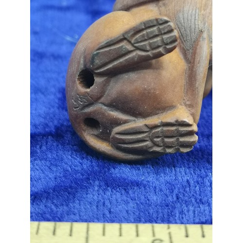 74 - Netsuke of mouse holding acorn.