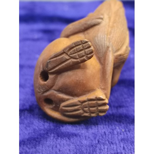 74 - Netsuke of mouse holding acorn.