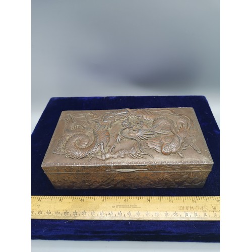 89 - Large heavy Chinese metal box depicting dragon  with wooden liner.