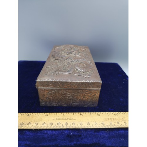 89 - Large heavy Chinese metal box depicting dragon  with wooden liner.