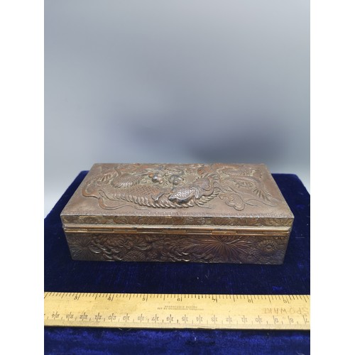 89 - Large heavy Chinese metal box depicting dragon  with wooden liner.