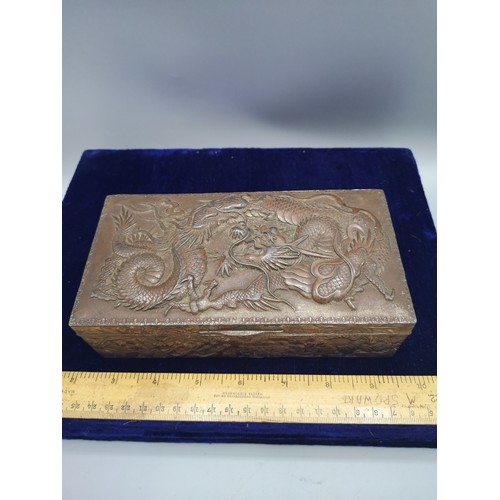 89 - Large heavy Chinese metal box depicting dragon  with wooden liner.