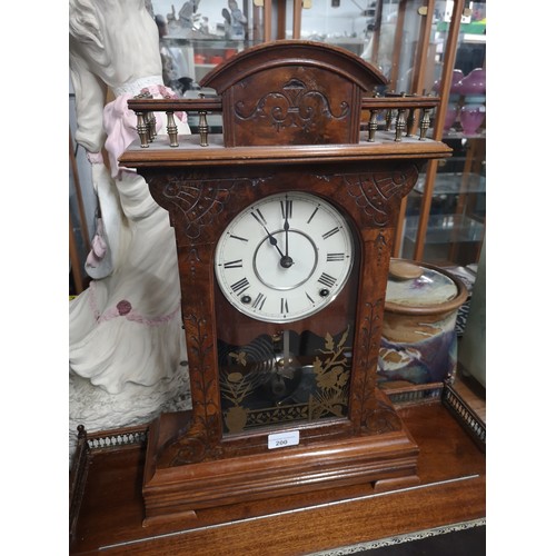 200 - Victorian 2 hole mantle clock with gallery setting. Comes with pendulum.