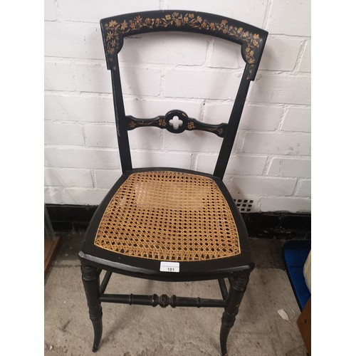 181 - 1900s chair with handpainted design with rattan base.