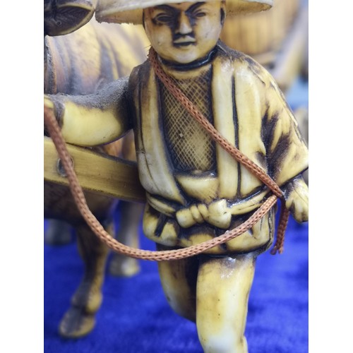 34 - Chinese figure display of farmer with transporting barrels.