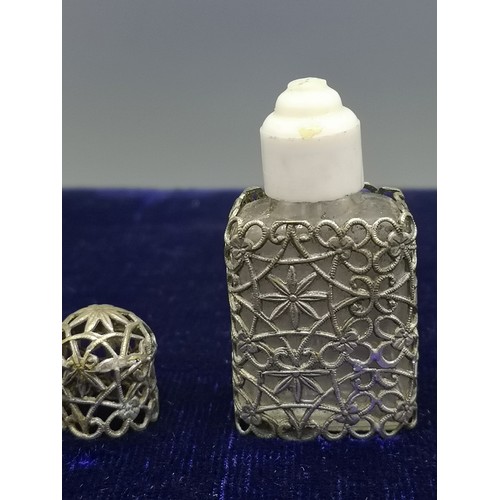 15 - Victorian fillagree perfume bottle with stopper and lid.