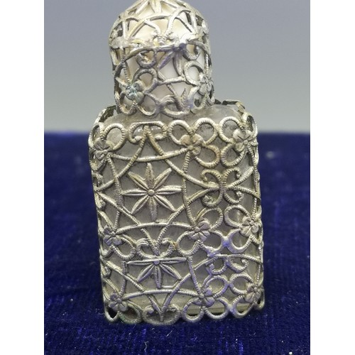 15 - Victorian fillagree perfume bottle with stopper and lid.