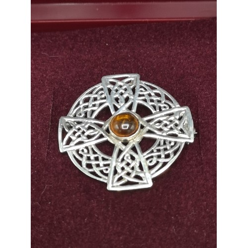 252 - Stunning Scottish silver brooch with Amber stone.