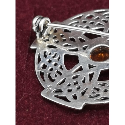 252 - Stunning Scottish silver brooch with Amber stone.