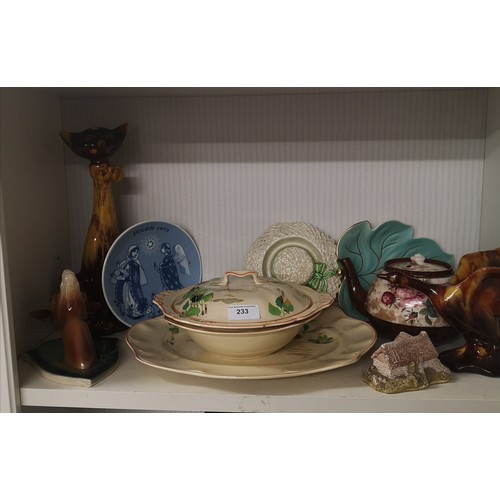 233 - Shelf of collectables to include Jena pottery art deco wall plaque etc .