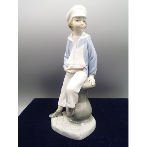 239 - Lladro boy sailor figure.