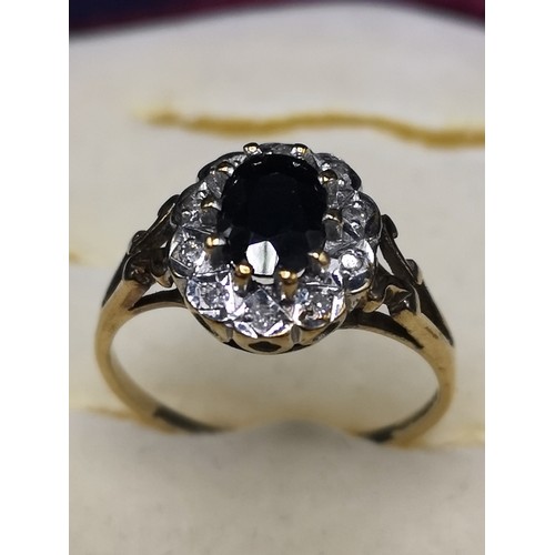 4a - 9ct gold diamond and sapphire ring.