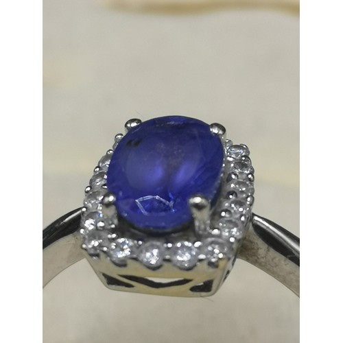 5a - 14kt white gold diamond and blue stone ring. 3.3 grams.