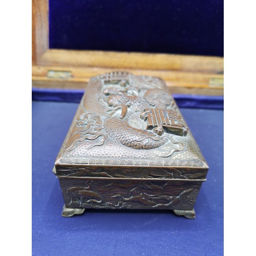 67a - Oriental bronze / brass box depicting dragon, storks to side.