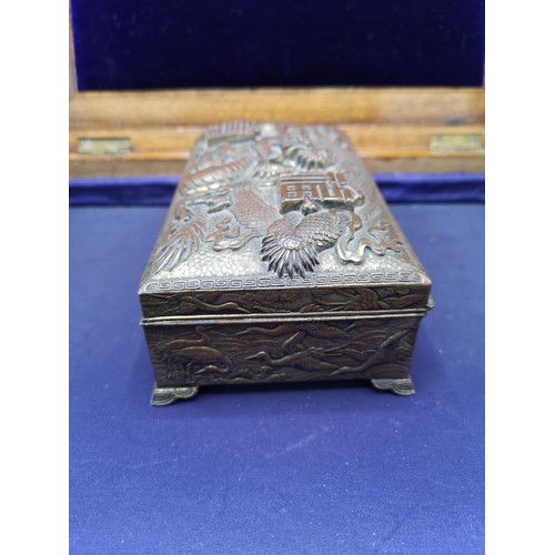 67a - Oriental bronze / brass box depicting dragon, storks to side.