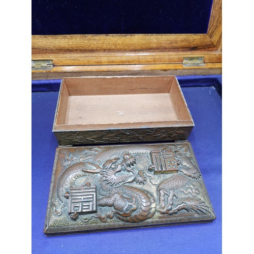 67a - Oriental bronze / brass box depicting dragon, storks to side.