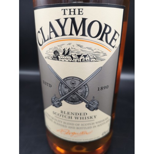 231 - Bottle of Claymore blended scotch whisky 1 litre full and sealed.