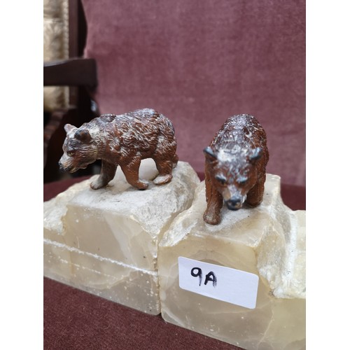 9a - Pair of cold painted bronze bears sat up on pieces of marble..