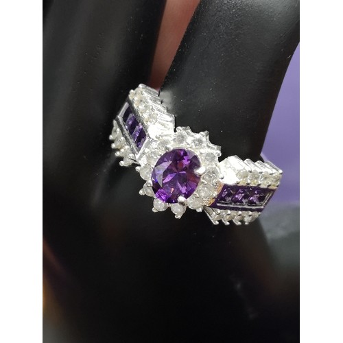 104A - Silver 925 Bling Ring set With purple & white stones.