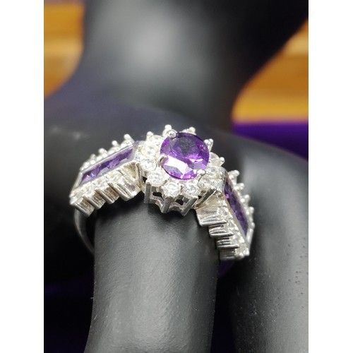 104A - Silver 925 Bling Ring set With purple & white stones.