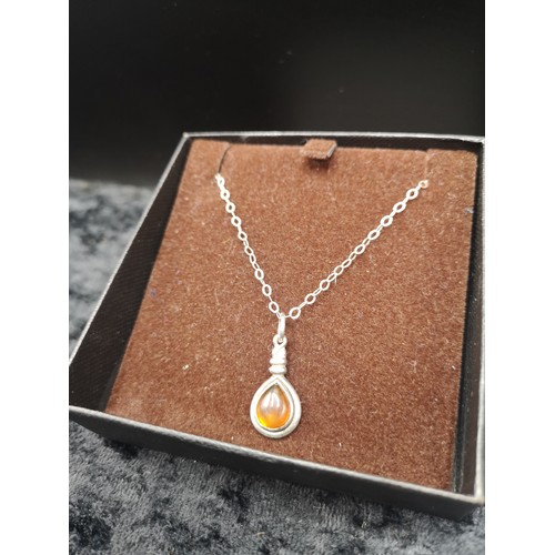 39 - Silver necklace in Amber setting.