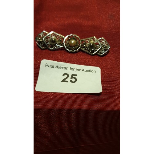 25 - Silver fillagree brooch with centre pearl.