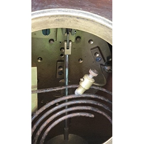 101 - 1900s Wooden cased clock with enamel face .