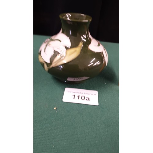 110a - Early Moorcroft white orchid green back ground vase.