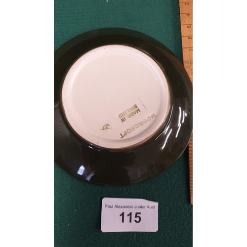 115 - Moorcroft Hibicus on green back ground dish.