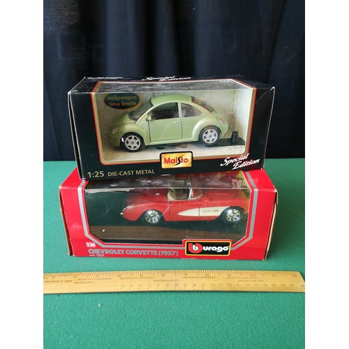 208 - Boxed burago chevrolet corvette 1957 model together maisto voltswagon beetle model.