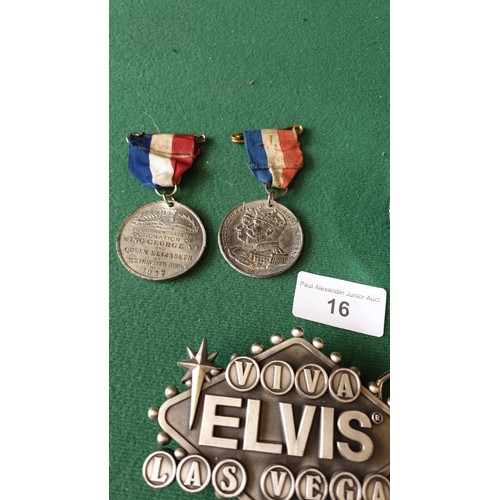 16 - 2 Elvis belt buckles , gents jaguar watch and selection of medals.